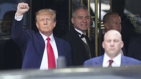 Trump surrenders at Manhattan courthouse ahead of historic arraignment